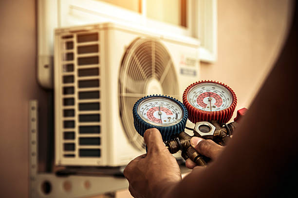 Professional Air Conditioning Service technician working in Mason, TN
